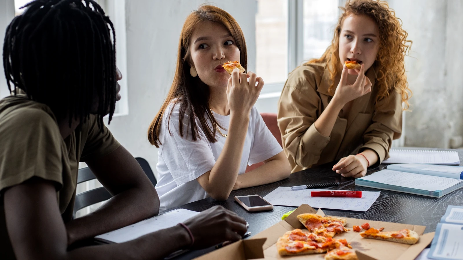 Students sharing food during a study session